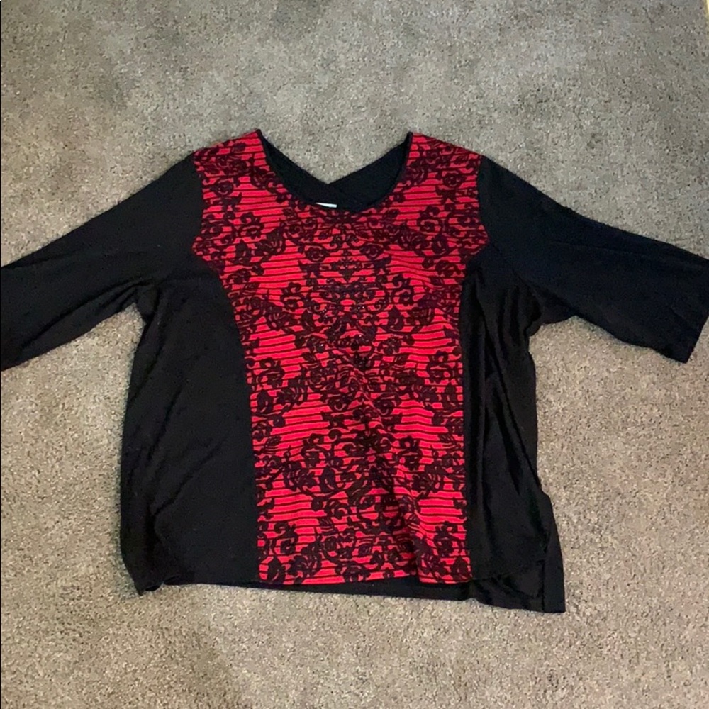 red and black blouse that has a little stretch